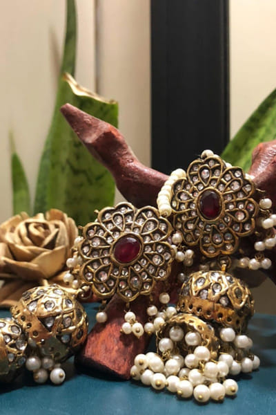 Gold and red kundan jhumkas