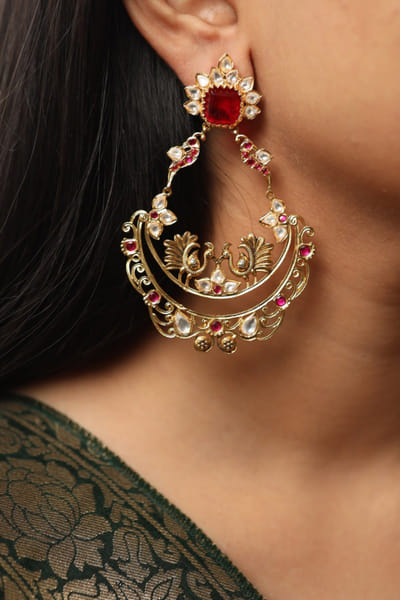 Gold and ruby embellished earrings