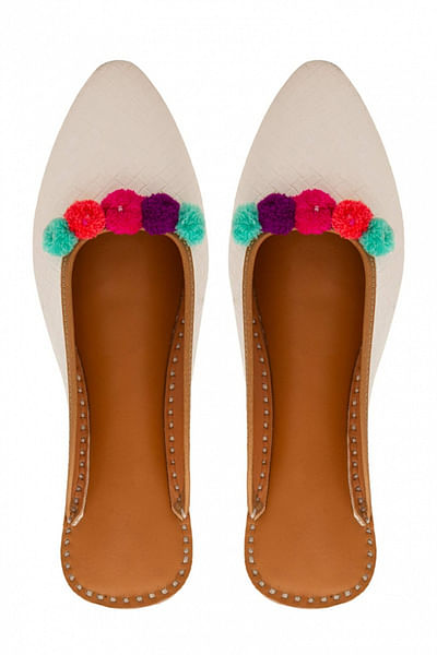 White pom pom slip-ons
