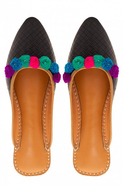 Black pom pom slip-ons