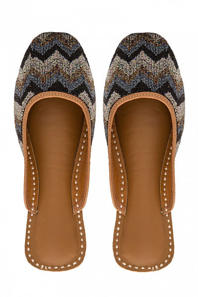 Black embellished slip-ons