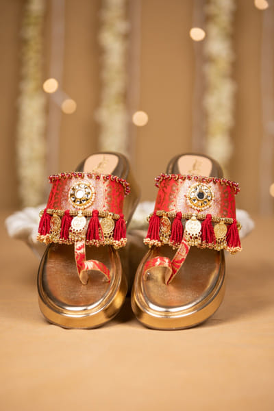 Red tasselled brocade wedges