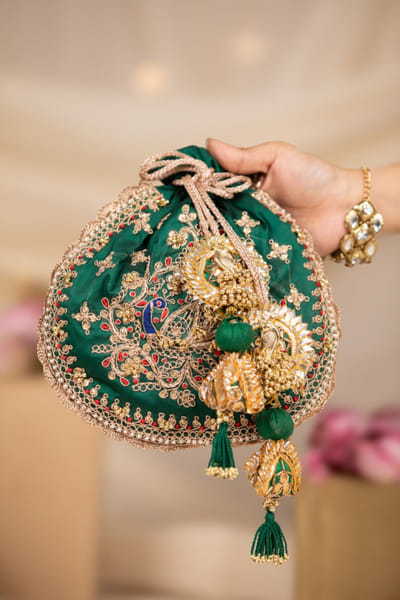 Green embroidered potli bag