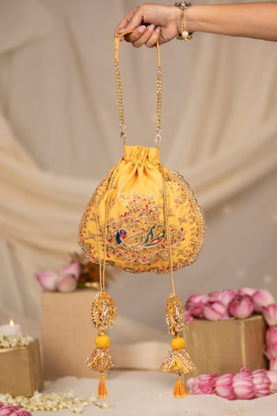 Yellow embroidered potli bag