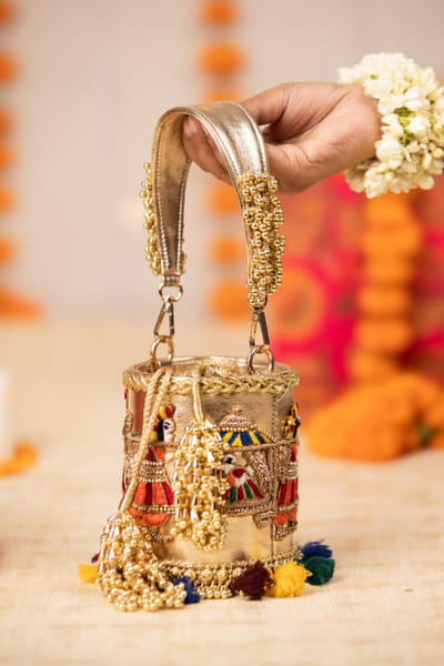 Gold embroidered bucket bag