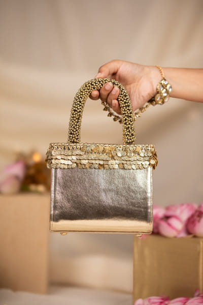 Gold sequin handbag