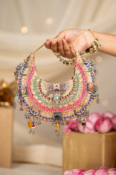 Gold crescent handbag