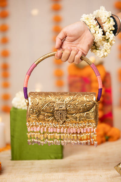 Gold embossed metal handbag