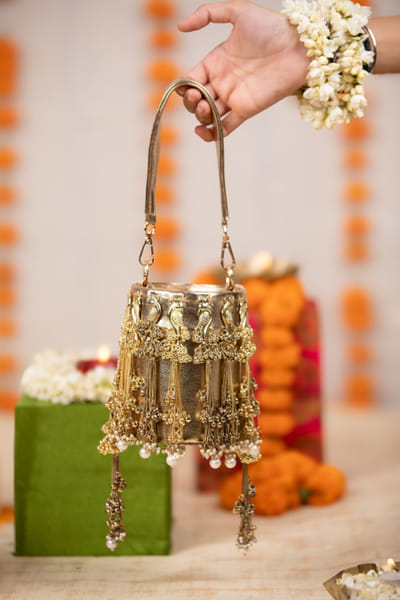 Gold metallic bucket bag