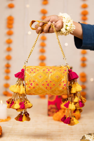 Yellow brocade handbag