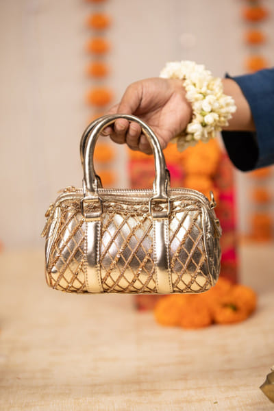 Gold quilted metallic handbag