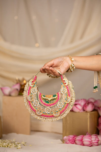 Gold embroidered crescent handbag