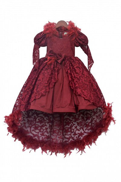 Maroon feather accented gown