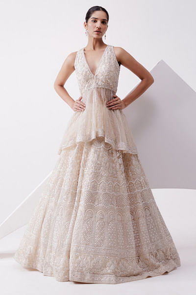 Beige embroidered peplum and lehenga set