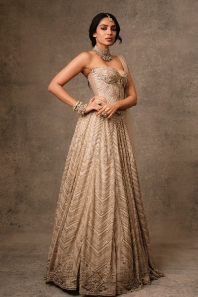 Ivory gold embellished corset and lehenga set
