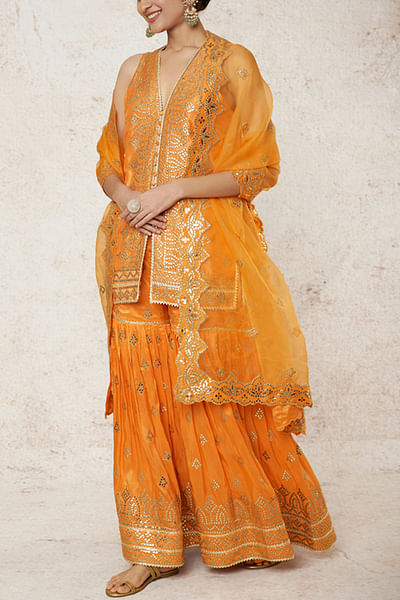 Orange tussar silk kurta and sharara set
