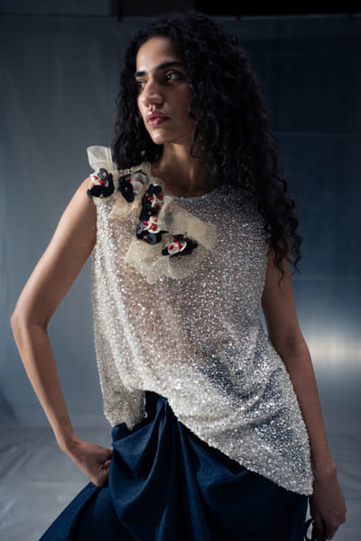 White sequin and rubber embellished top