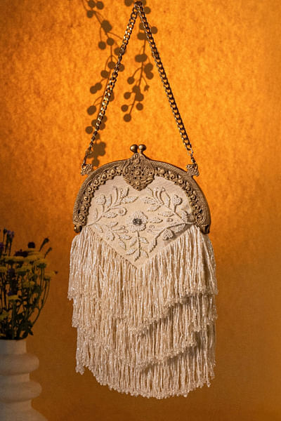 Ivory floral embroidered tassel potli bag