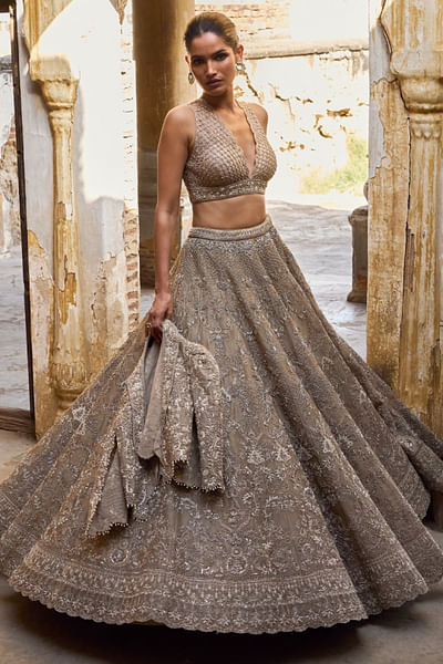 Golden beige zardozi jacket and lehenga set