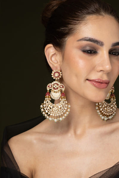 Red stone embellished chandbali earrings