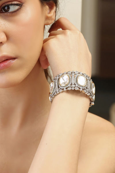 Silver stone and kundan embellished bangle