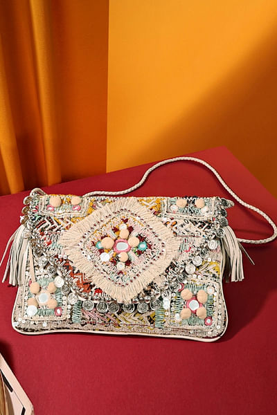 Cream coin embellished clutch
