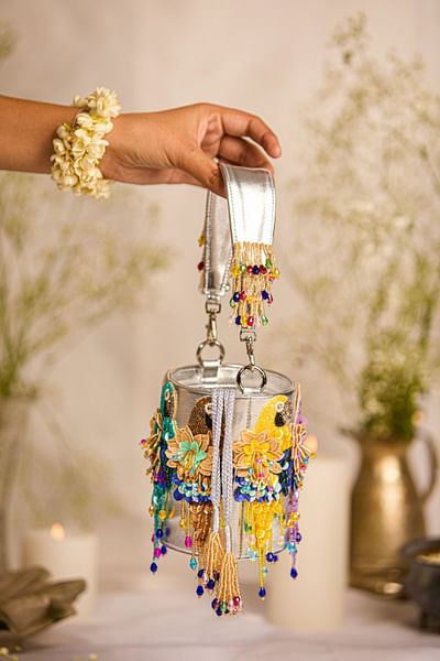 Silver parrot-floral bead tasselled bucket bag