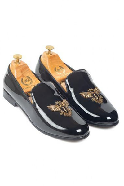 Black embroidered leather slip ons