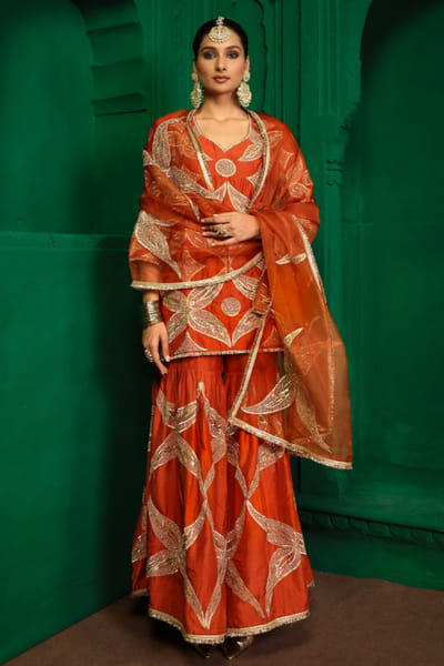Charu Makkar Rust orange gota embroidered gharara set CHARJUL26D149450