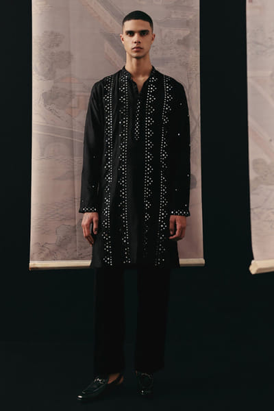 Black stretch crepe flared pants