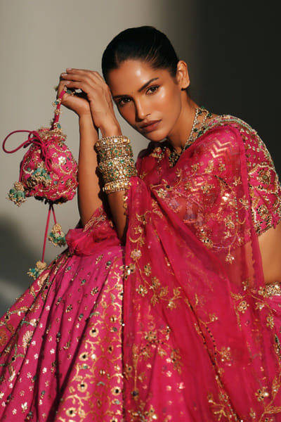 Rani pink hand embroidered potli bag