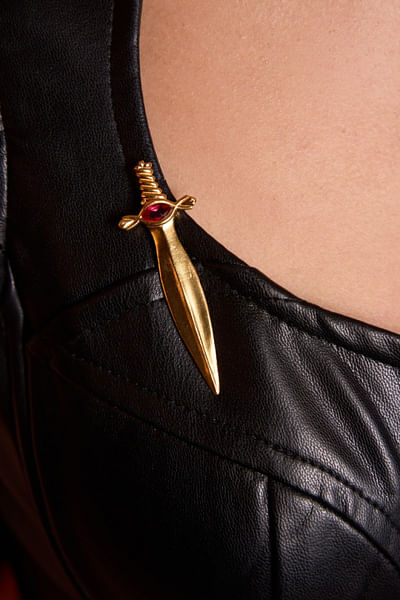 Gold stone dagger brooch