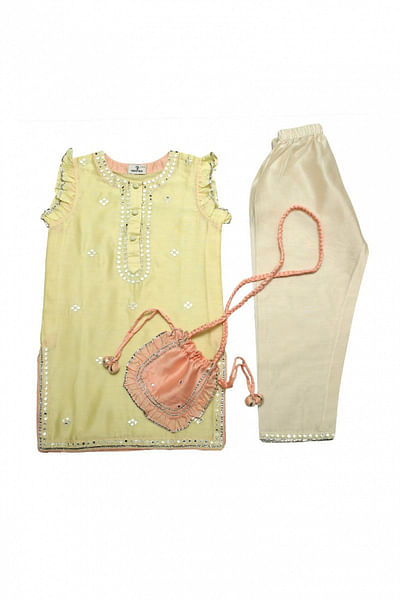 Yellow kurta set and potli bag
