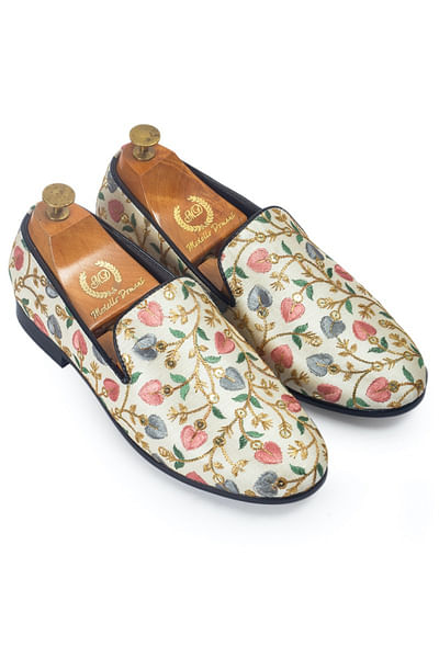 Beige embroidered slip-ons