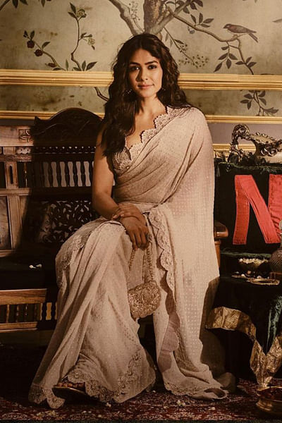 Ivory hand embroidered bandhani sari set.