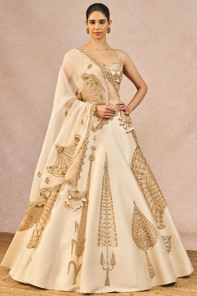 Ivory and gold paankh motif embroidered lehenga set