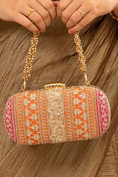 Orange and pink embroidered clutch