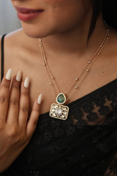 Gold and green stone embellished necklace set