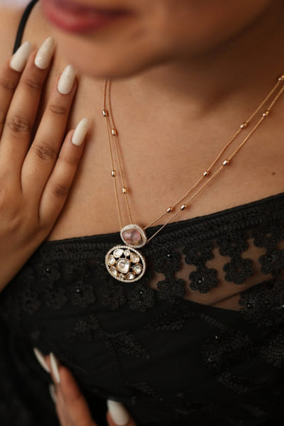 Gold and pink stone embellished necklace set