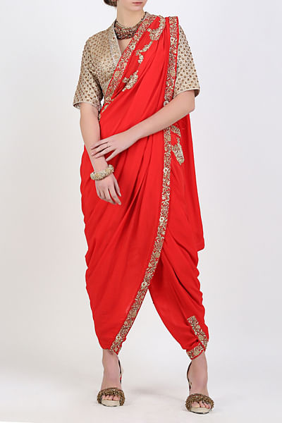 Red dhoti sari with gold brocade blouse