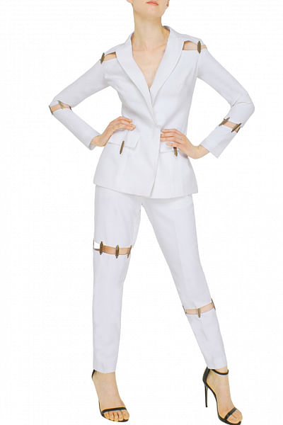 White blazer and pant set with metal chip detailing