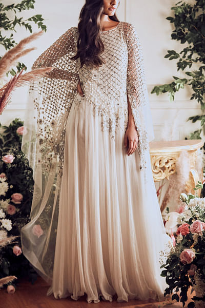 Ivory embellished cape gown