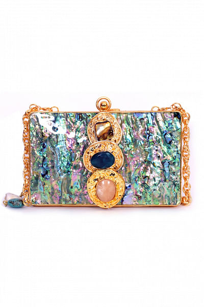 Mother of pearl clutch with gold caps and stones