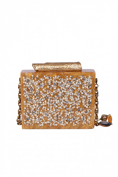 Laser-cut clutch with embroidered pearl work
