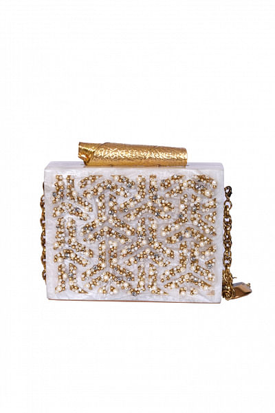 Laser-cut clutch with embroidered pearl work