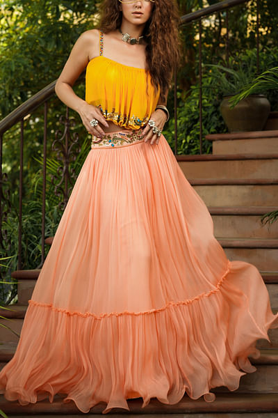 Yellow embroidered top and peach skirt