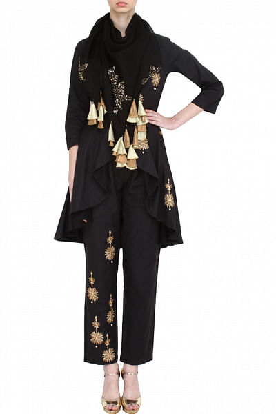 Black embroidered peplum jacket with slim pants and silk scarf
