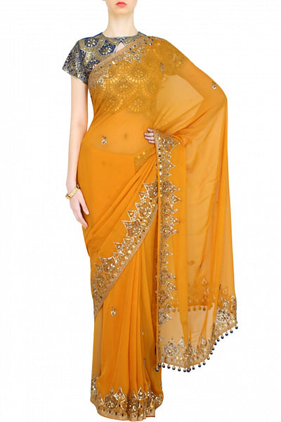 Mustard yellow georgette sari with teal blue blouse