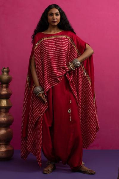 Red bandhani asymmetric cape and dhoti set