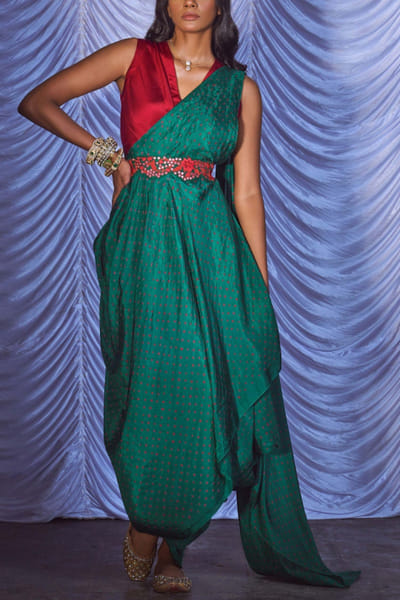 Green draped sari and red blouse